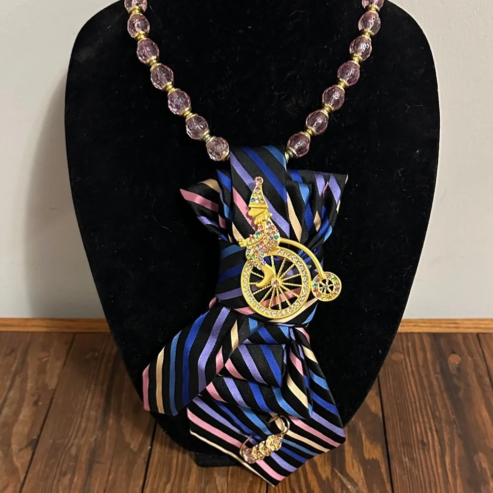 Multicolored vintage silk tie Necklace with a clown on a penny farthing brooch